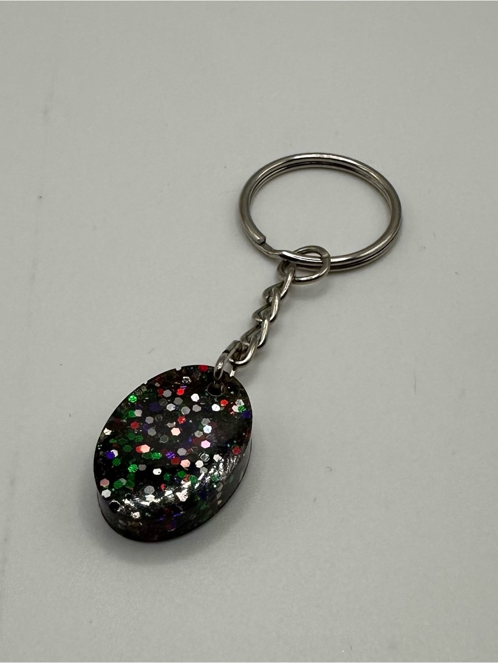 Small Resin Glitter Oval Keychain - Black Multicolor Glitter
